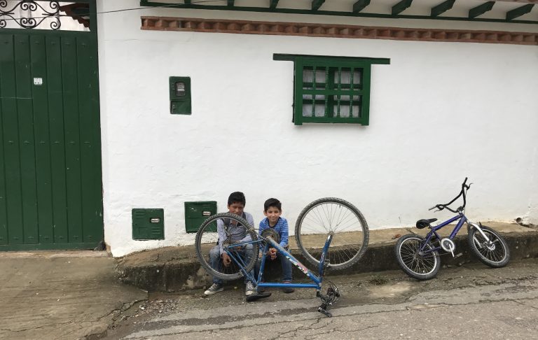 Two boys and their bikes in colonial Villa de Leyva